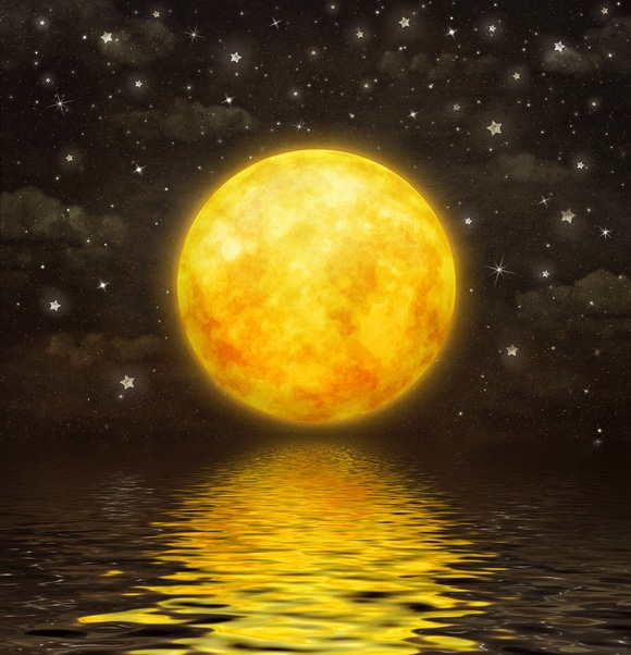 golden supermoon reflection on water